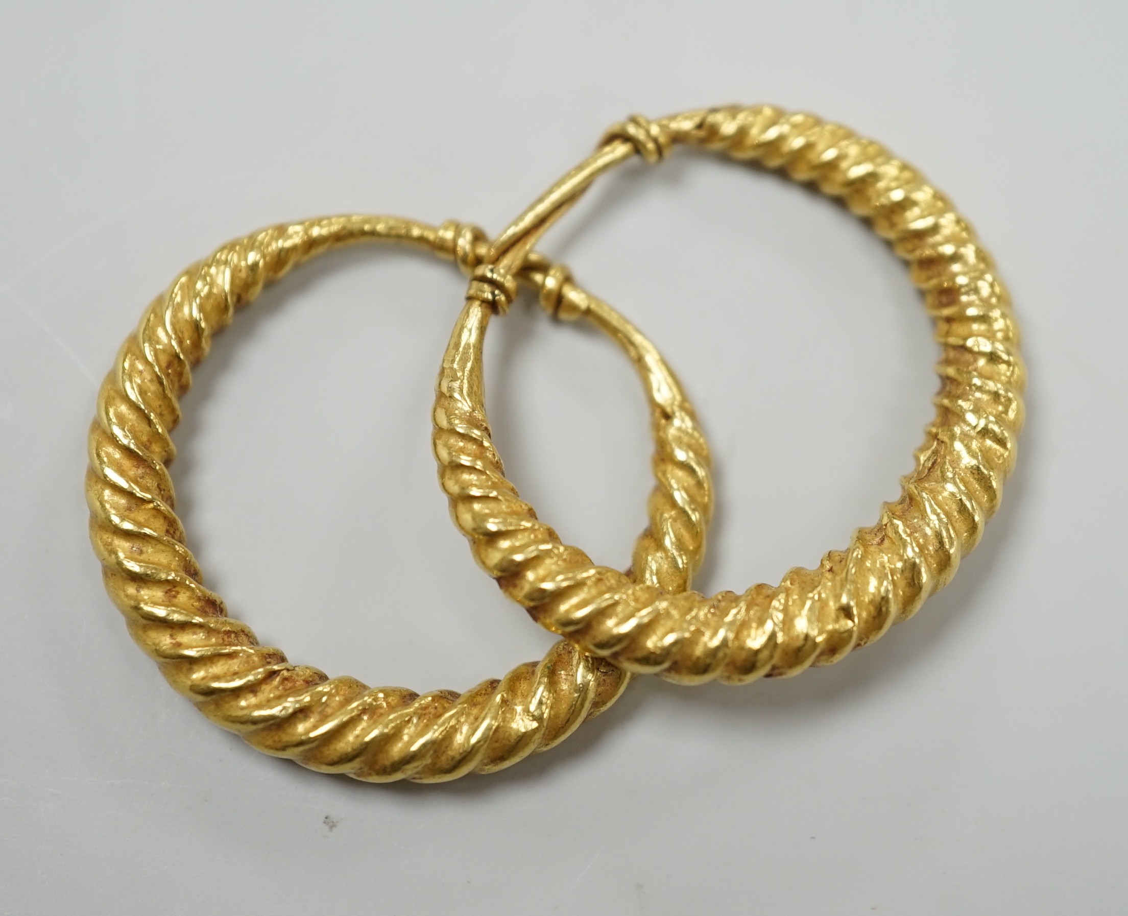 A pair of possibly Roman? yellow metal spiral twist loop earrings, 30mm, 8 grams.